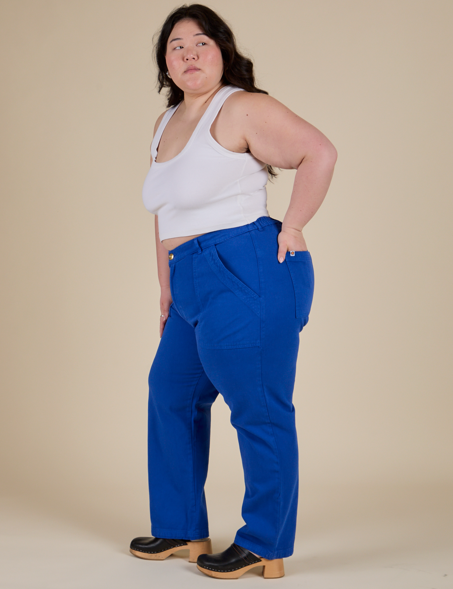 Side view of Work Pants in Royal Blue and vintage tee white Cropped Tank on Ashley