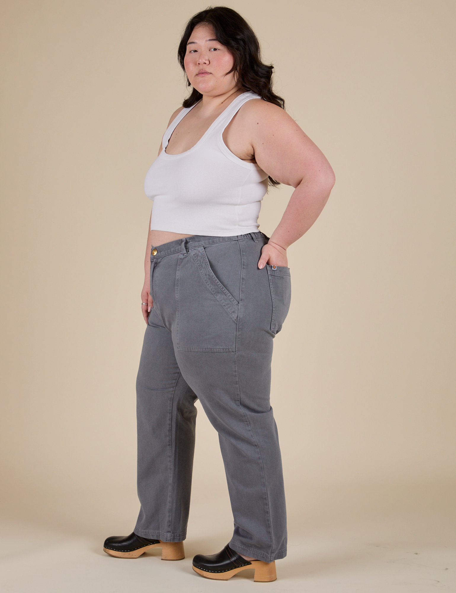 Side view of Work Pants in Washed Grey and Cropped Tank in Vintage Tee White on Ashley