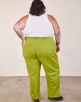 Back view of Work Pants in Gross Green and Cropped Tank in vintage tee off-white on Sam