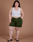 Ashley is 5’7” and wearing 1XL Classic Work Shorts in Evergreen paired with a Cropped Tank in Vintage Tee White