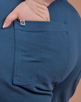 Close up of Ashley's hand in the back pocket of Classic Work Shorts in French Blue