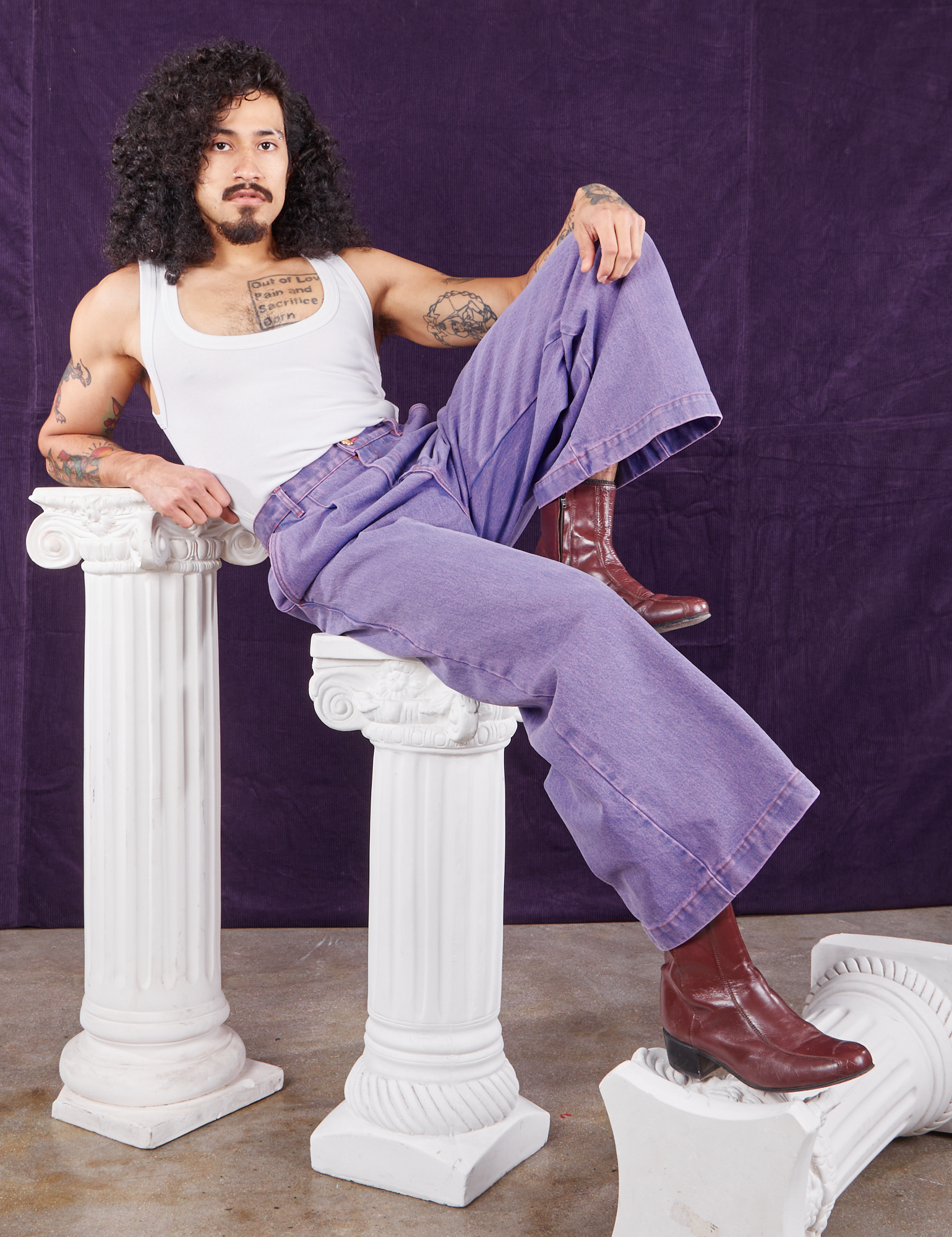 Jesse is wearing Overdyed Wide Leg Trousers in Faded Grape and vintage off-white Cropped Tank Top