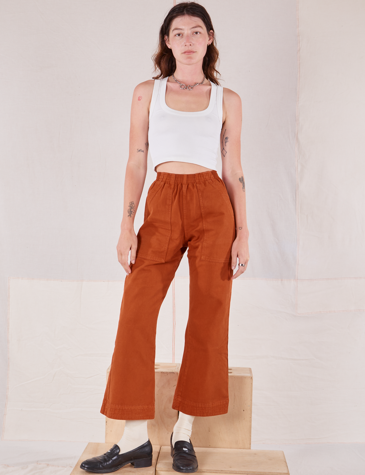 Alex is 5&#39;8&quot; and wearing P Action Pants in Burnt Terracotta paired with a Cropped Tank in vintage tee off-white