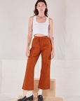 Alex is 5'8" and wearing P Action Pants in Burnt Terracotta paired with a Cropped Tank in vintage tee off-white