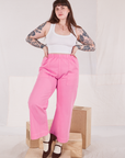 Sydney is 5'9" and wearing L Action Pants in Bubblegum Pink paired with a Cropped Tank in vintage tee off-white