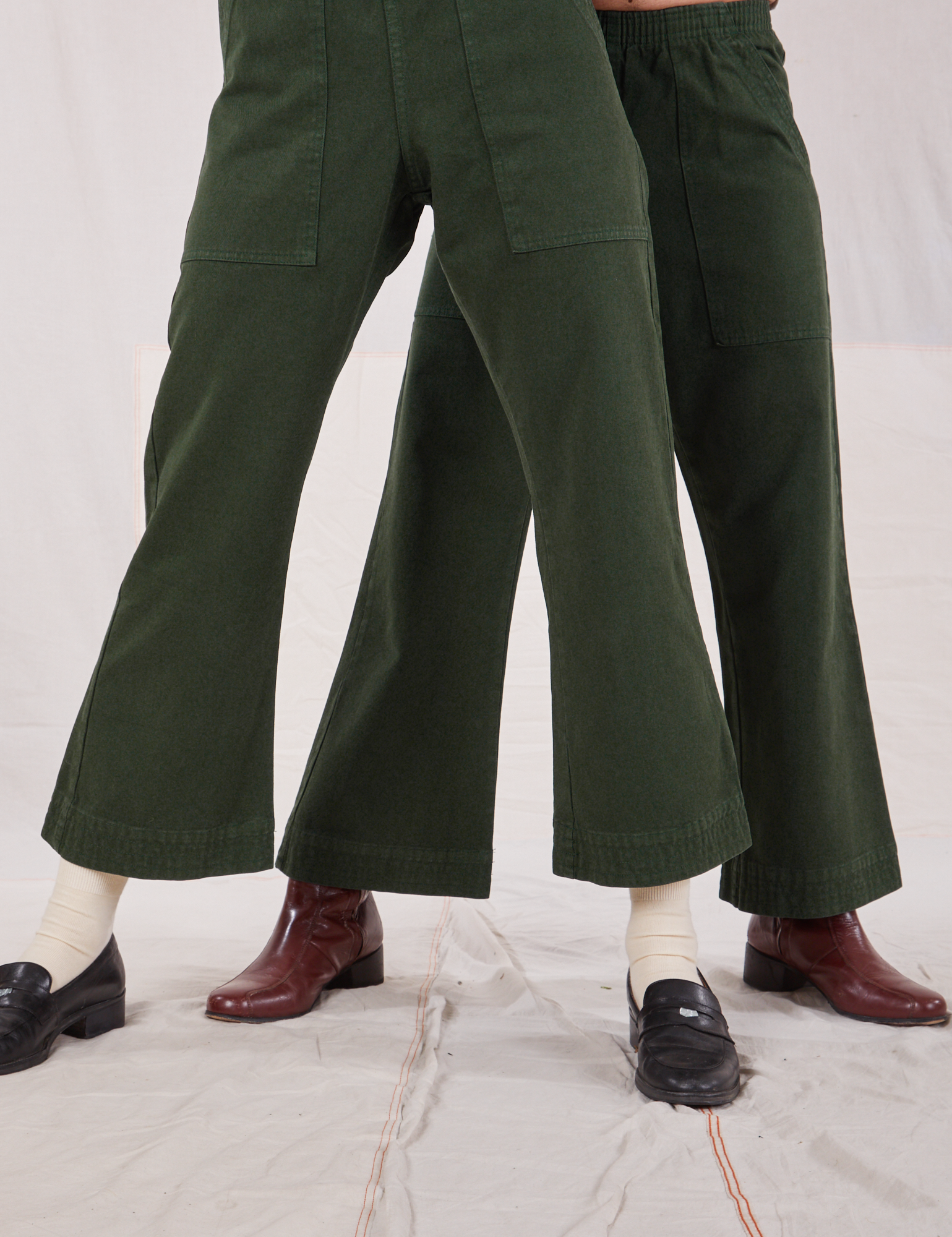 Alex and Jesse are both wearing Action Pants in Swamp Green