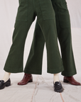 Alex and Jesse are both wearing Action Pants in Swamp Green