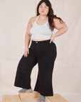 Ashley is wearing Petite Bell Bottoms in Basic Black and vintage off-white Halter Top