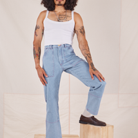 Jesse is 5'8" and wearing XS Carpenter Jeans in Light Wash paired with a vintage off-white Cami