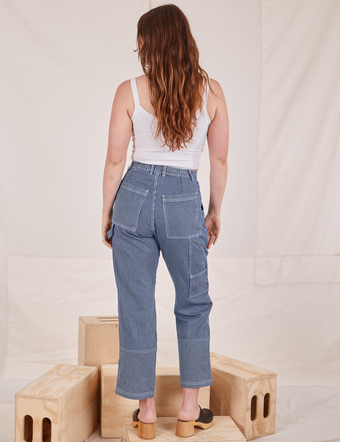 Back view of Carpenter Jeans in Railroad Stripes worn by Allison
