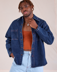 Issac is wearing Denim Overshirt in Dark Wash