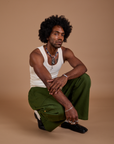 Drop Pocket Cargo Pants in Evergreen and Tank Top in vintage tee white worn by Jerrod