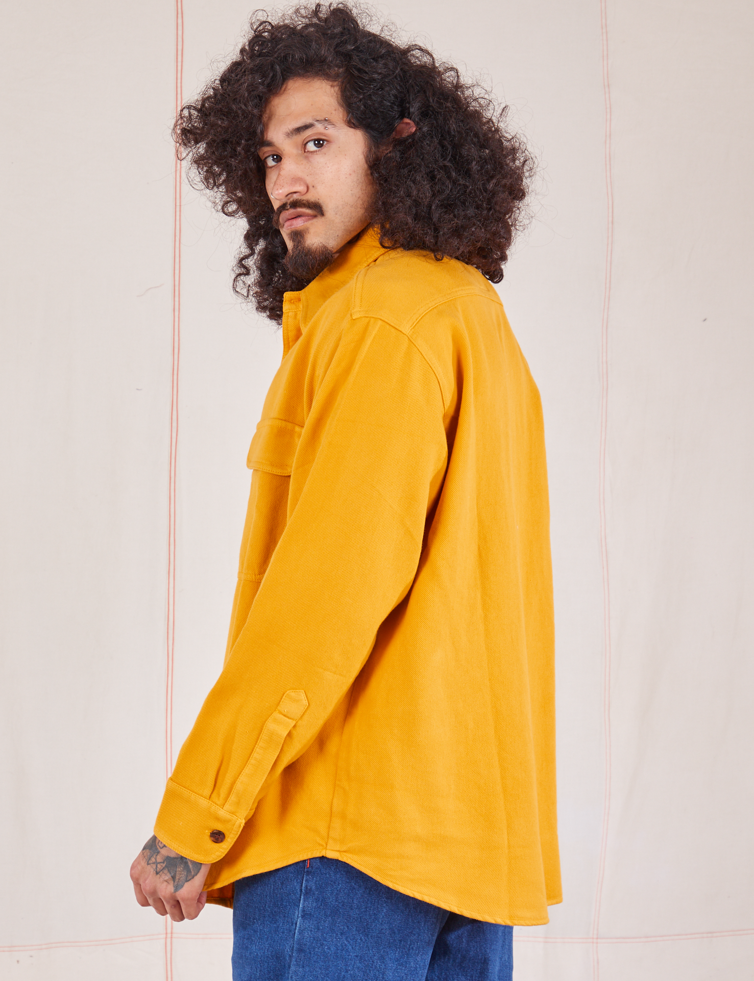 Side view of Flannel Overshirt in Mustard Yellow on Jesse