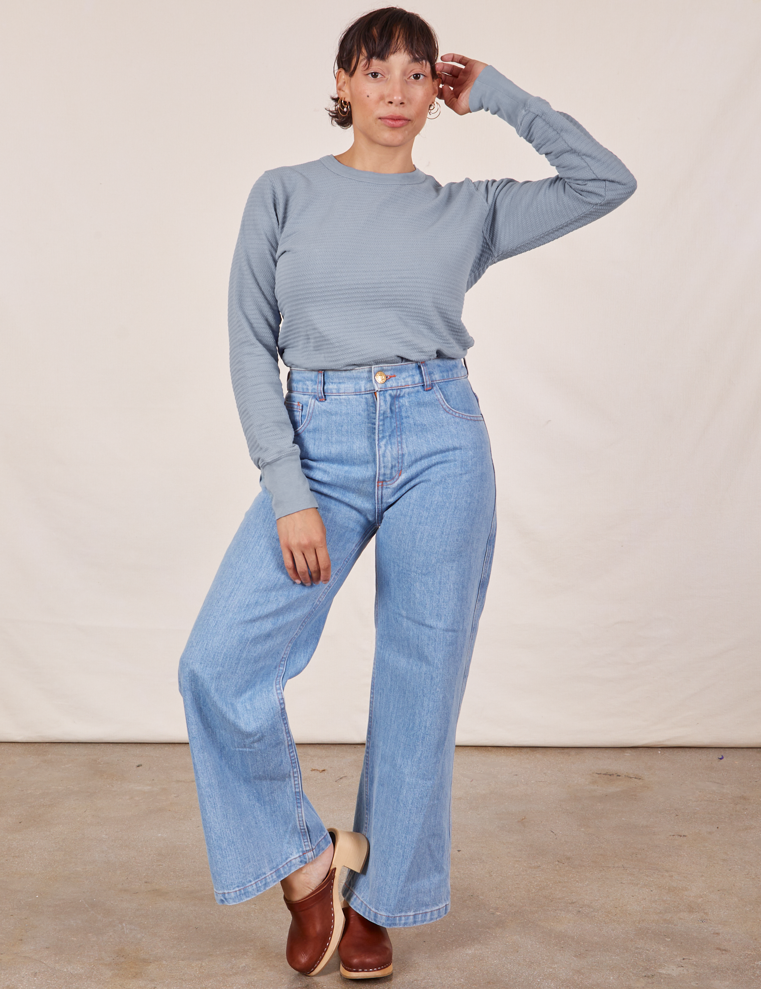 Tiara is wearing Honeycomb Thermal in Periwinkle tucked into light wash Sailor Jeans