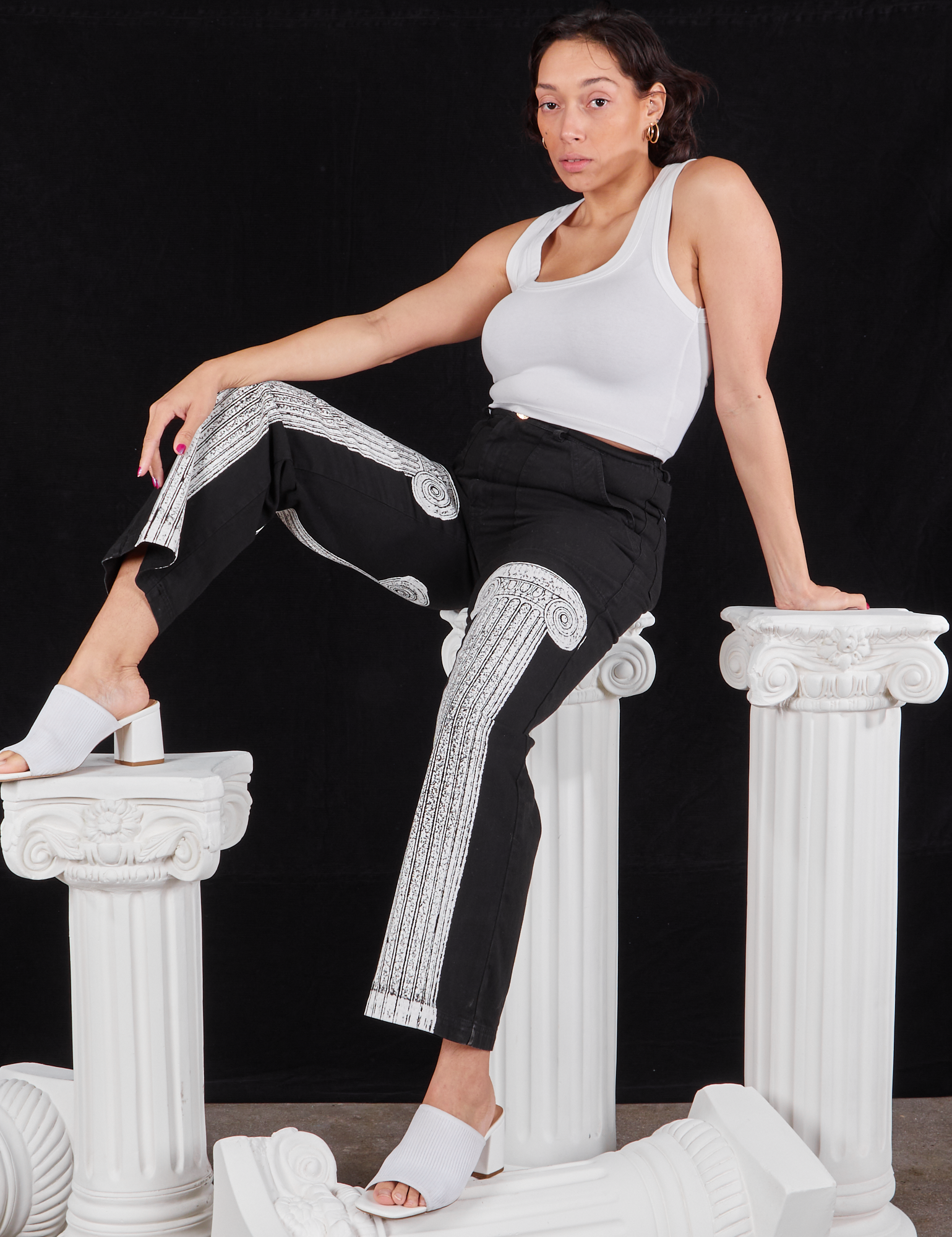 Tiara is wearing Column Work Pants in Basic Black and vintage off-white Cropped Tank Top