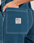 Original Overalls in Lagoon back pocket close up on Tiara