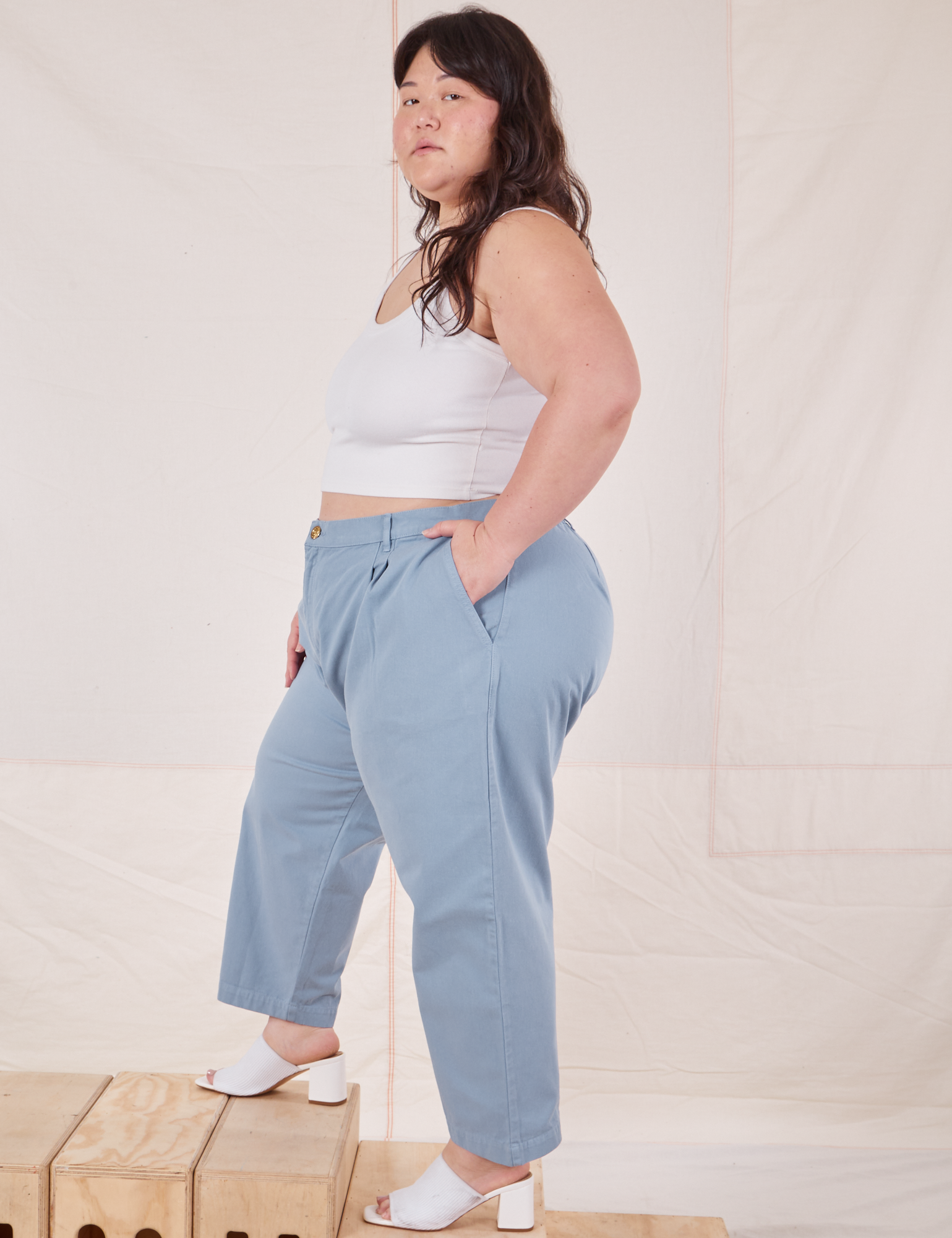 Side view of Heavyweight Trousers in Periwinkle and vintage off-white Cropped Cami 