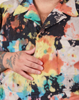 Front close up of Short Sleeve Jumpsuit in Rainbow Magic Waters worn by Sam