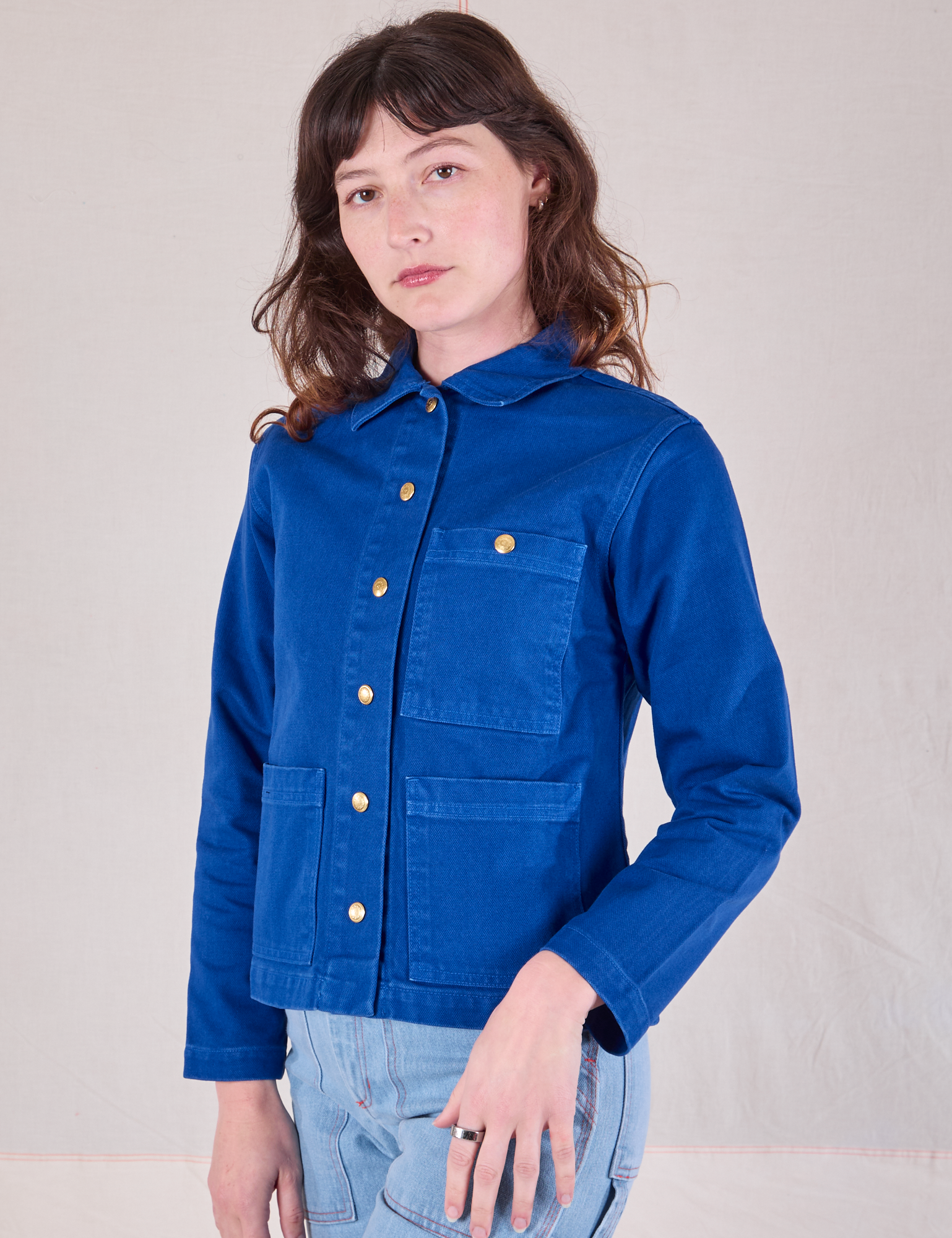 Angled front view of Denim Work Jacket in Royal Blue on Alex