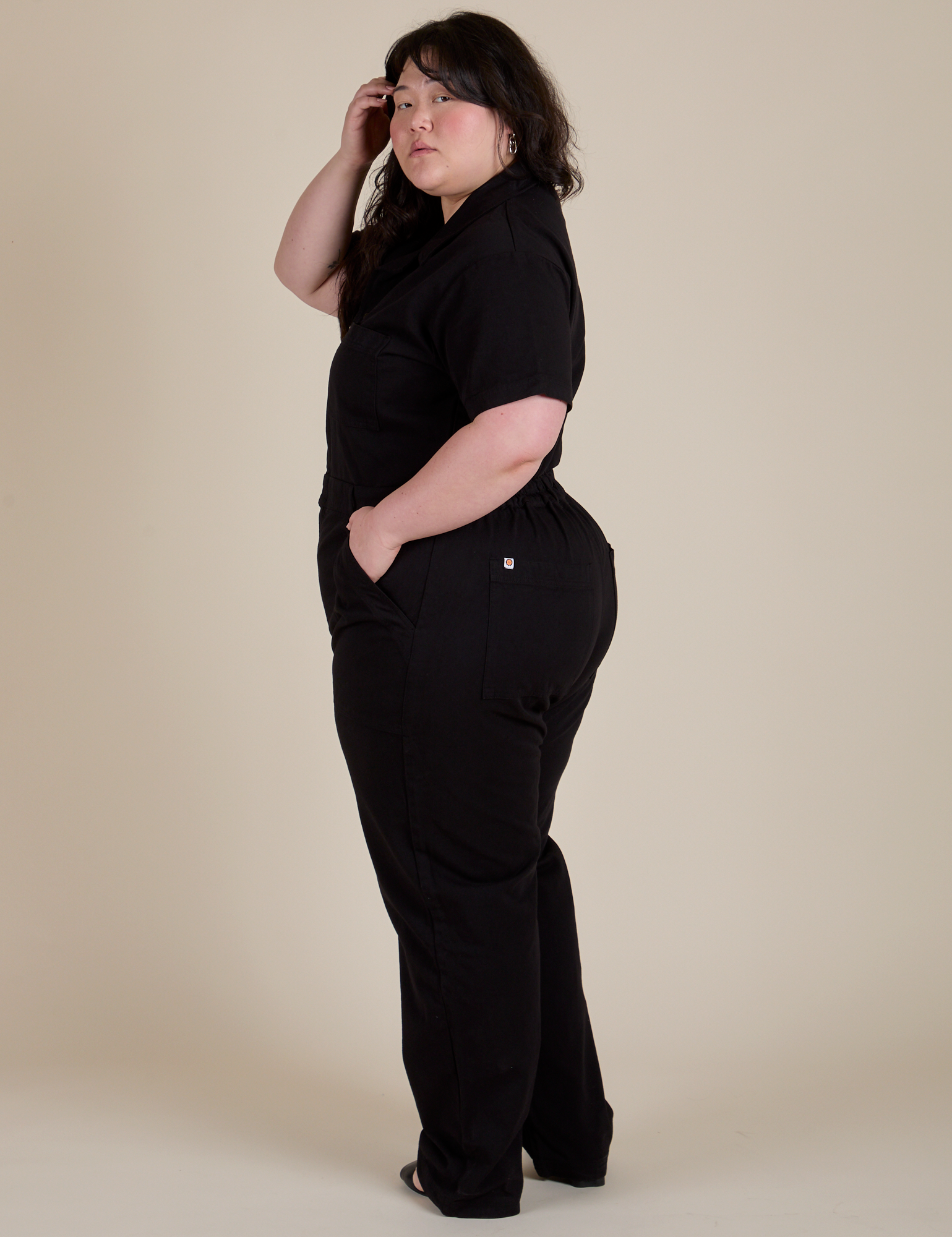 Short Sleeve Jumpsuit in Basic Black side view on Ashley