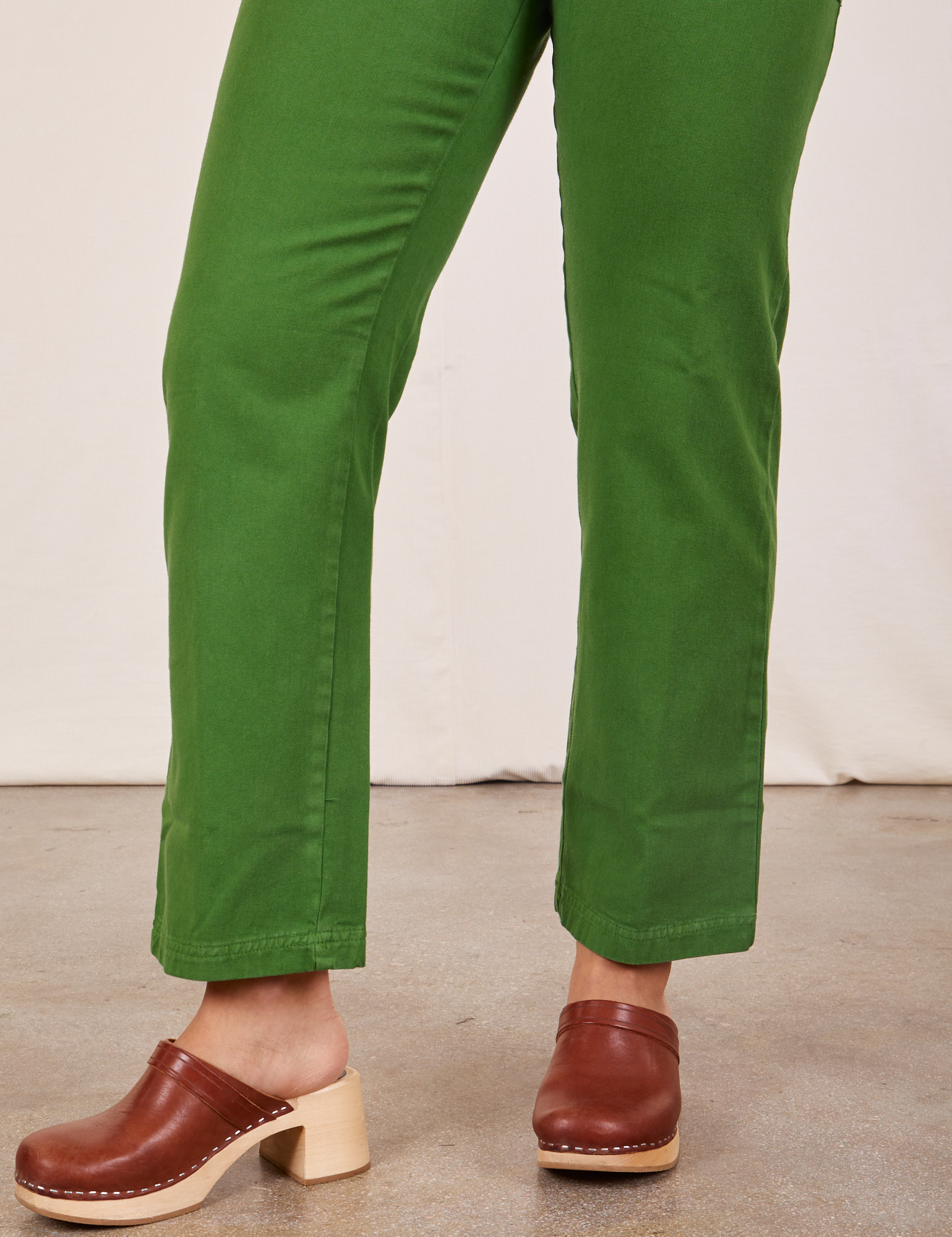 Pant leg close up of Short Sleeve Jumpsuit in Lawn Green worn by Gabi