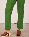 Pant leg close up of Short Sleeve Jumpsuit in Lawn Green worn by Gabi