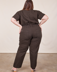 Back view of Short Sleeve Jumpsuit in Espresso Brown worn by Marielena