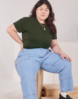 Ashley is wearing Organic Vintage Tee in Swamp Green and light wash Carpenter Jeans