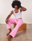 Jerrod is wearing Cropped Rolled Cuff Sweatpants in Bubblegum Pink and vintage off-white Cropped Tank Top