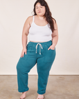 Ashley is 5'7" and wearing XL Cropped Rolled Cuff Sweatpants in Marine Blue paired with vintage off-white Cami