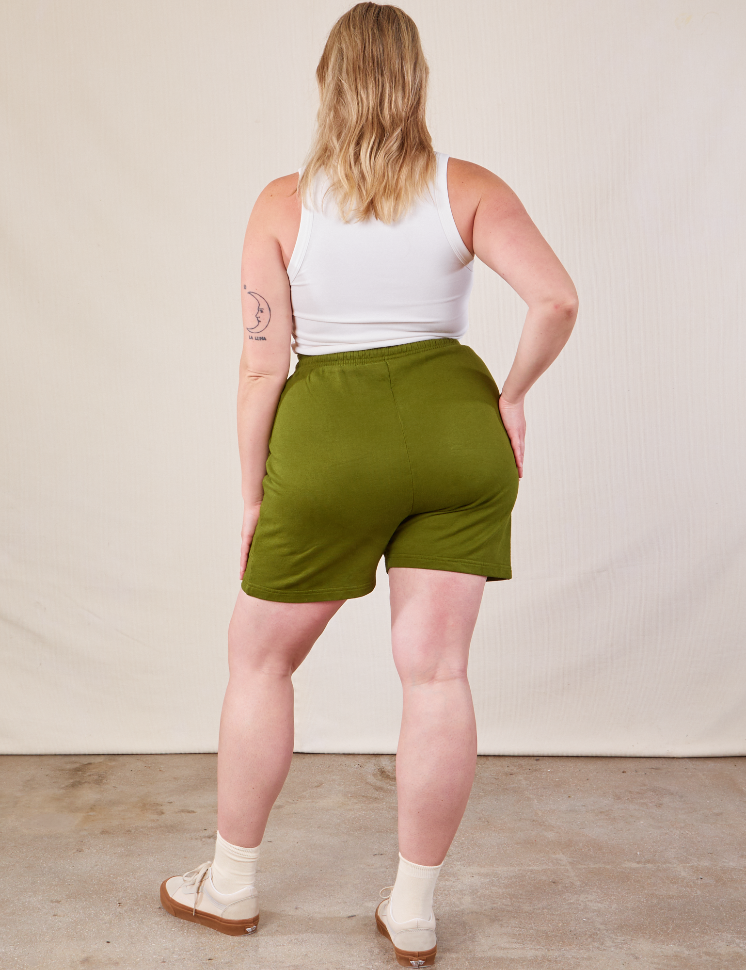 Back view of Lightweight Sweat Shorts in Summer Olive and Cropped Tank in vintage tee off-white on Lish