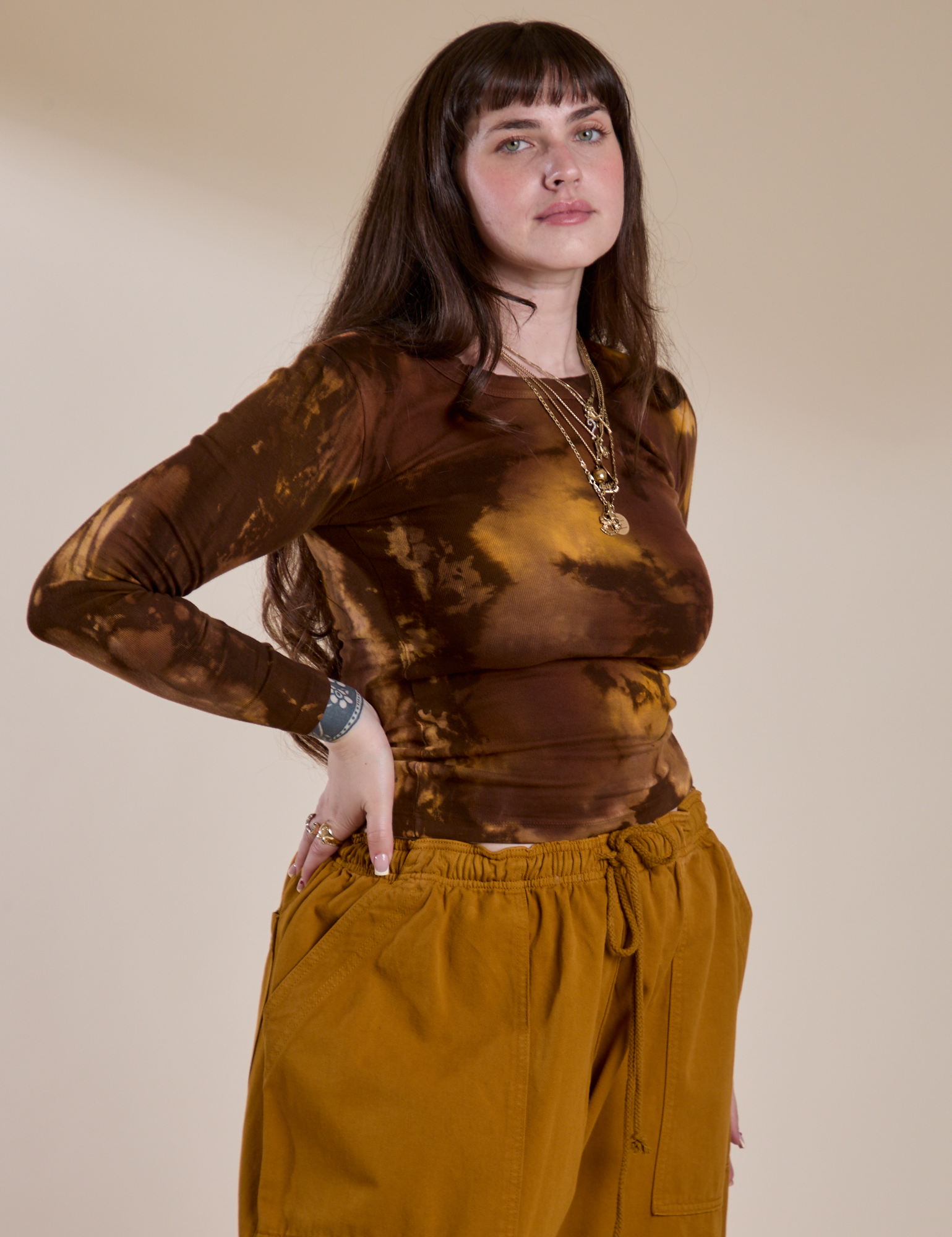 Angled front view of Long Sleeve Baby Tee in Honey Brown on Sydney