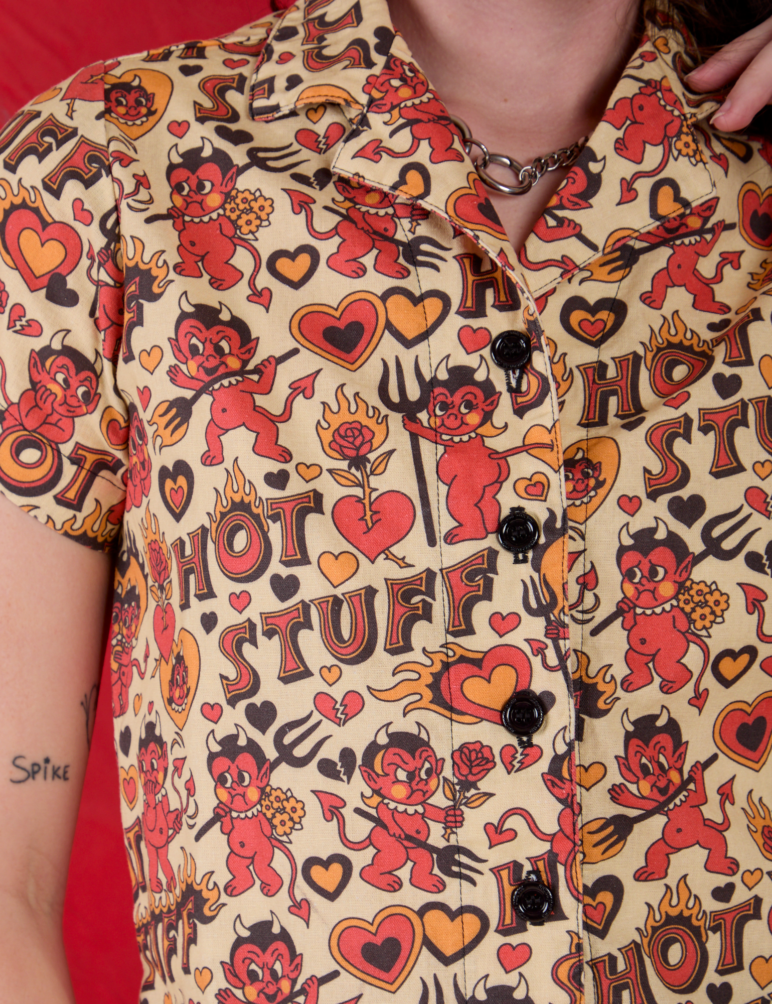 Front close up of Hot Stuff Print Pantry Button-Up worn by Alex