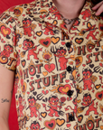 Front close up of Hot Stuff Print Pantry Button-Up worn by Alex