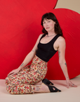 Work Pants in Hot Stuff Print and black Cropped Tank worn by Alex