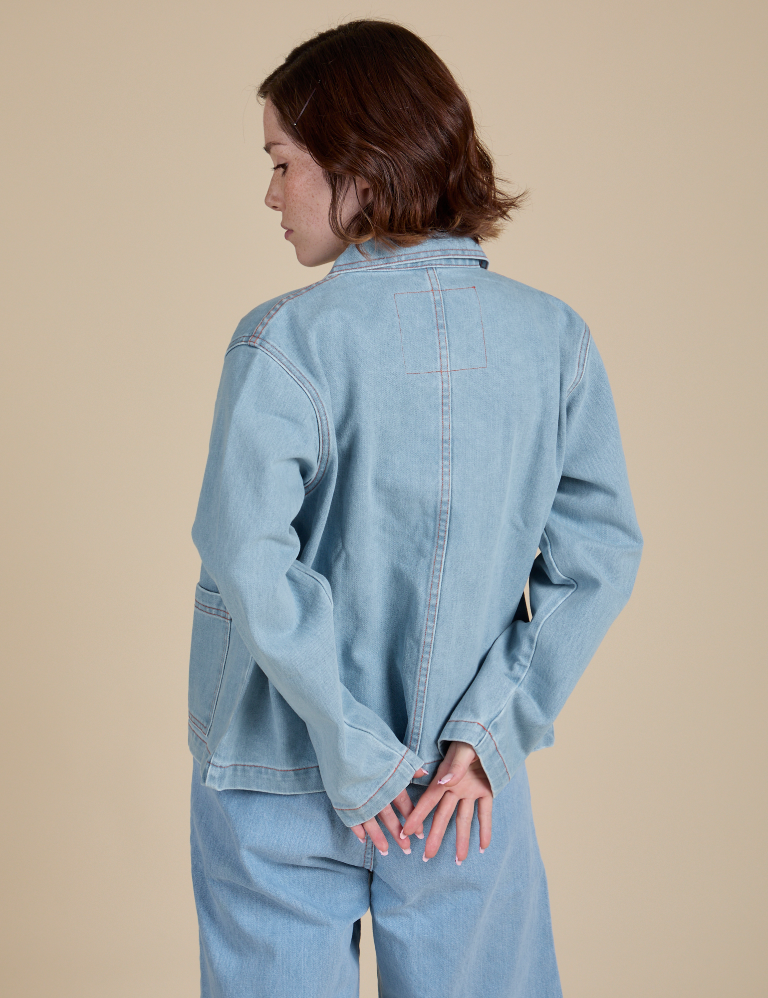 Back view of Indigo Denim Work Jacket in Light Wash on Hana