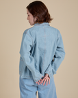 Back view of Indigo Denim Work Jacket in Light Wash on Hana