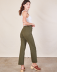 Angled back view of Work Pants in Surplus Green on Alex