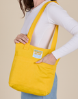 Over-Shoulder Zip Mini Tote in Sunshine Yellow worn on shoulder of model