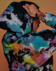 Angled back view close up of Oversized Hoodie in Rainbow Magic Waters on Anthony