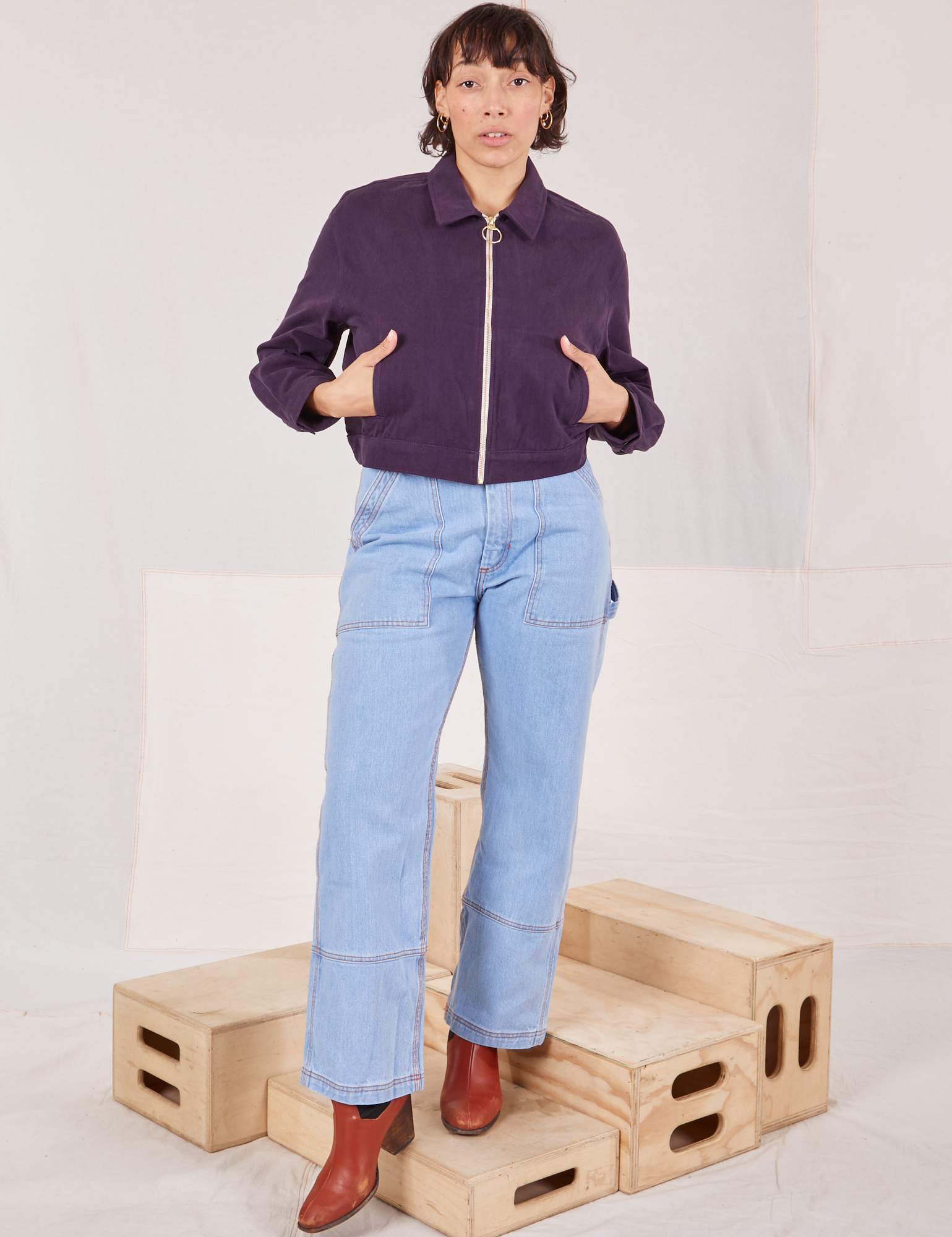 Tiara is wearing Ricky Jacket in Nebula Purple and light wash Carpenter Jeans