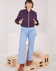 Tiara is wearing Ricky Jacket in Nebula Purple and light wash Carpenter Jeans