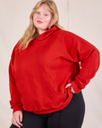 Oversized Hoodie in Mustang Red angled front view on Juliet