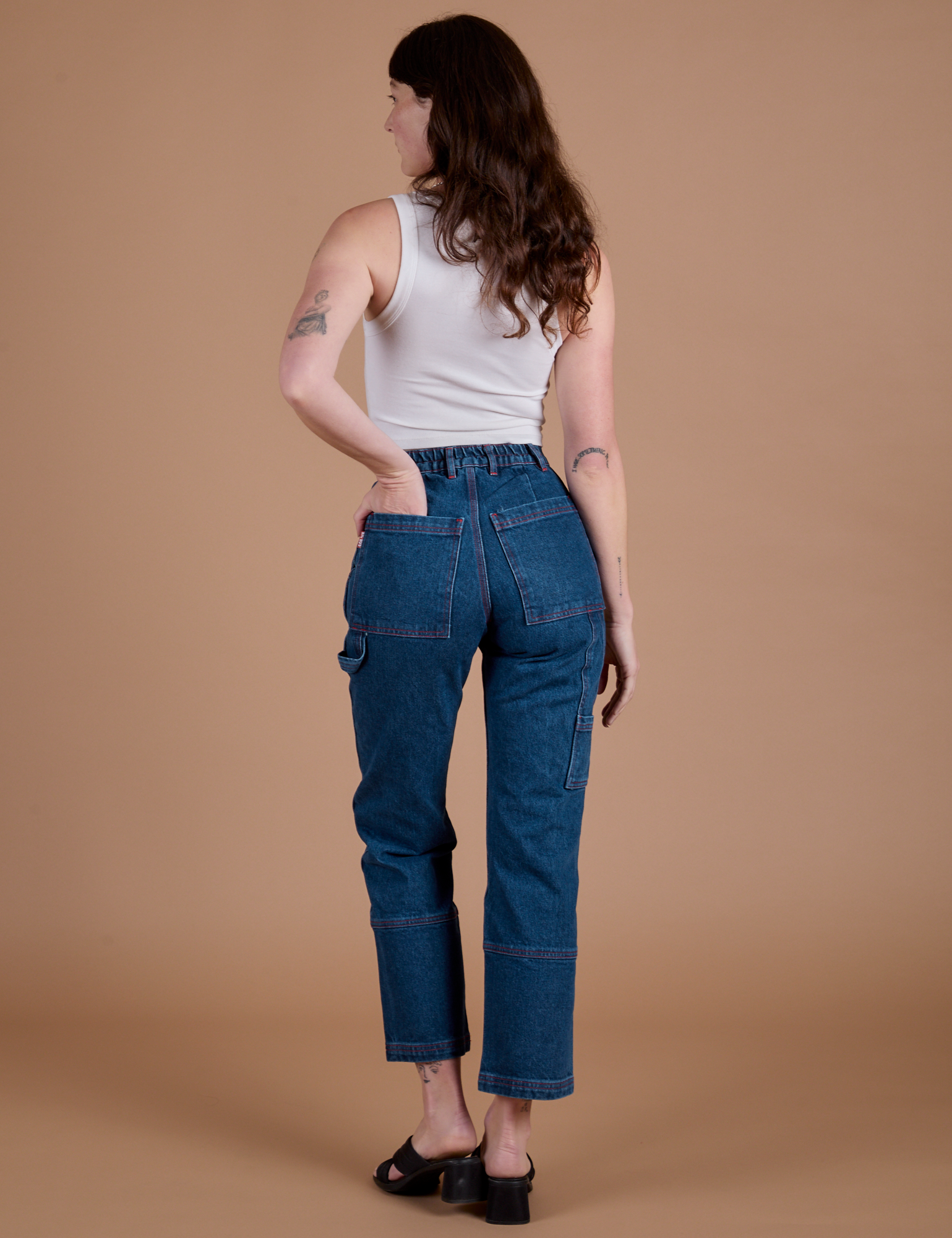 Carpenter Jeans in Dark Wash back view on Alex