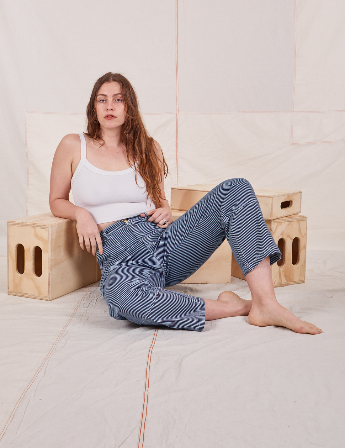 Allison is wearing Carpenter Jeans in Railroad Stripes and vintage off-white Cami