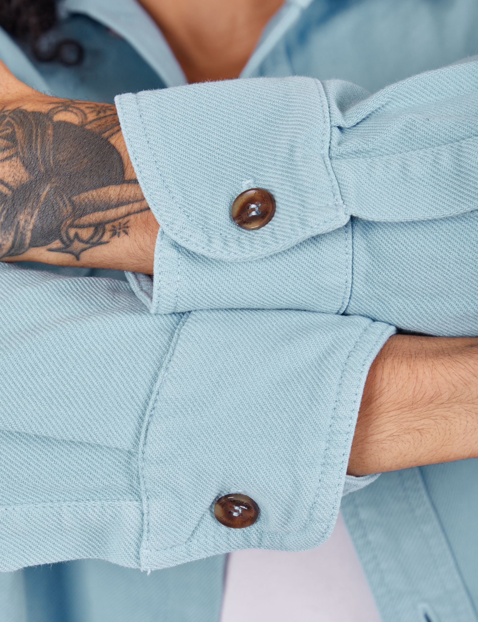 Sleeve cuffs close up of Flannel Overshirt in Baby Blue on Jesse