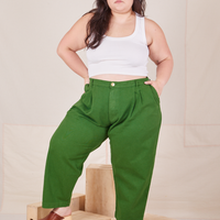 Ashley is 5'7" and wearing 1XL Petite Heavyweight Trousers in Lawn Green paired with vintage off-white Cropped Tank Top