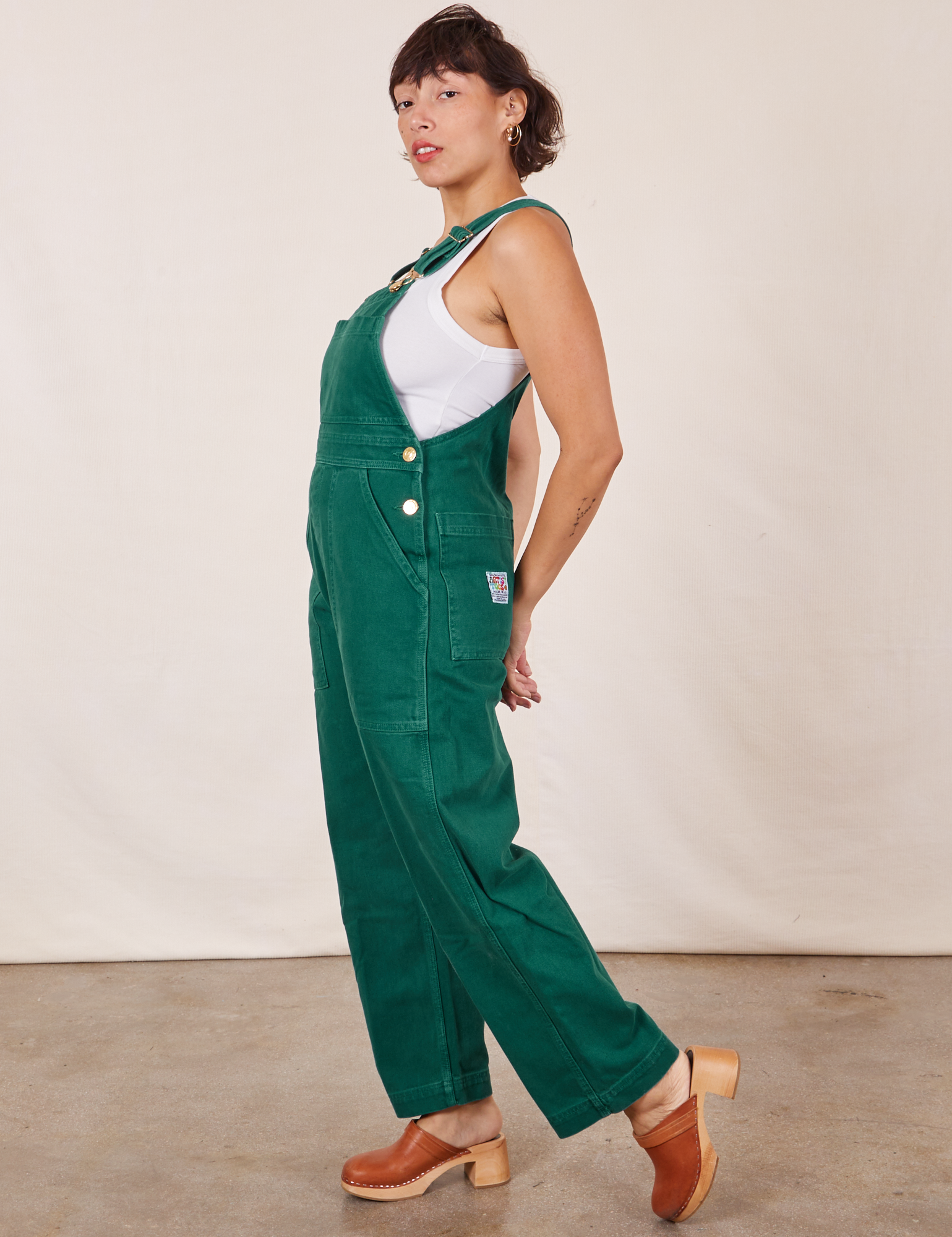 Side view of Original Overalls in Mono Hunter Green worn by Tiara