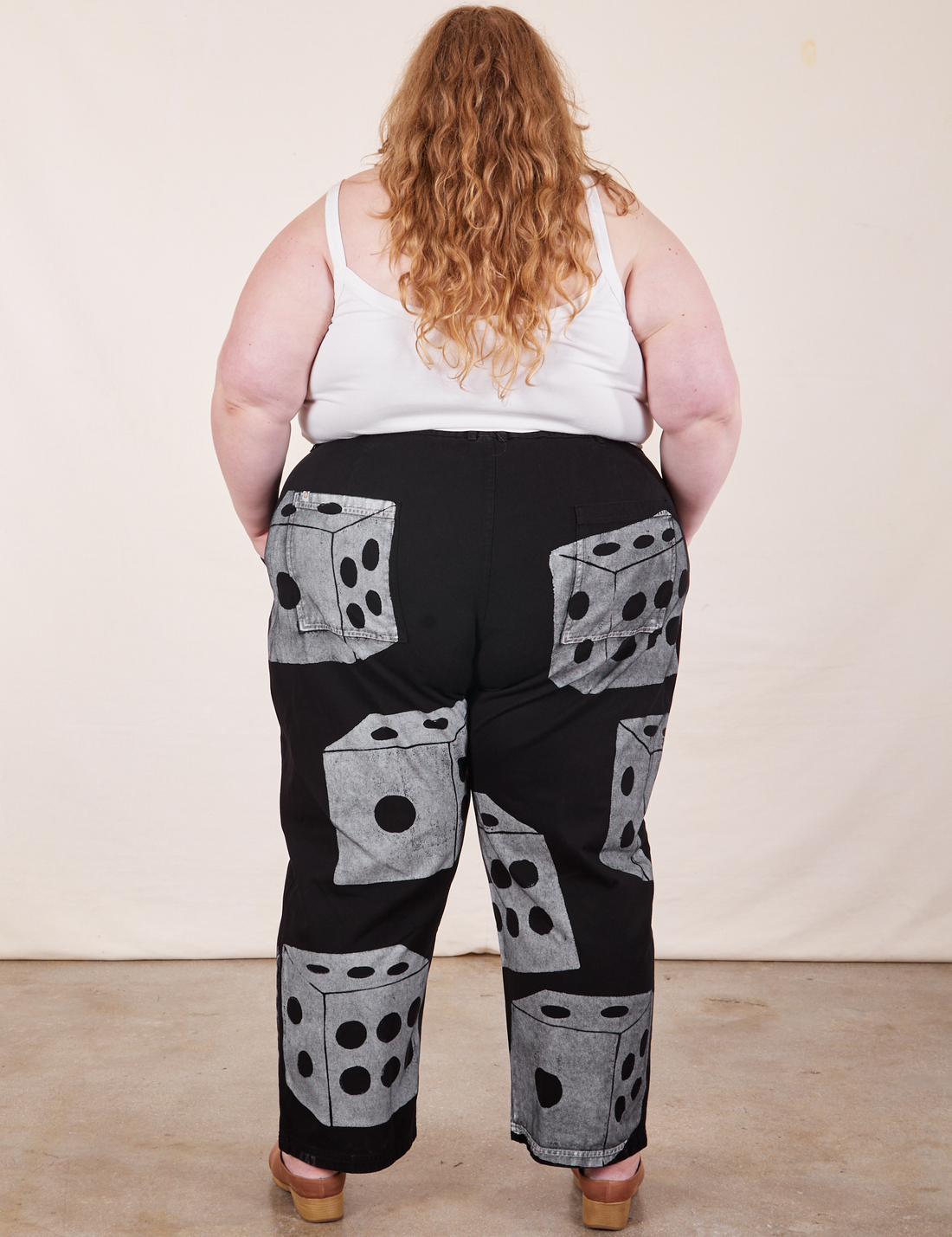 Back view of Icon Work Pants in Dice and vintage off-white Cropped Cami worn by Catie