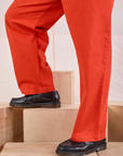 Mid-Rise Pleated Trousers in Chili Red pant leg close up on Issac